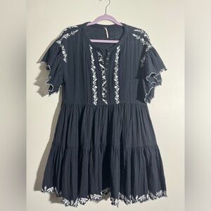 Free People size xs black gauze like dress with white embroidery